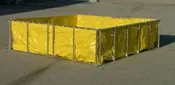 Yellow portable water storage tank with a metal frame, suitable for emergency water containment.