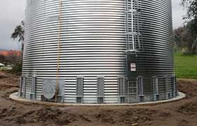 Large corrugated tank installed on a concrete pad