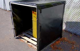 Pallet with a drum on it inside of a heater blanket hot box