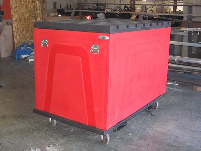 A red rectangular refuse container on wheels with a black top, designed for industrial use.